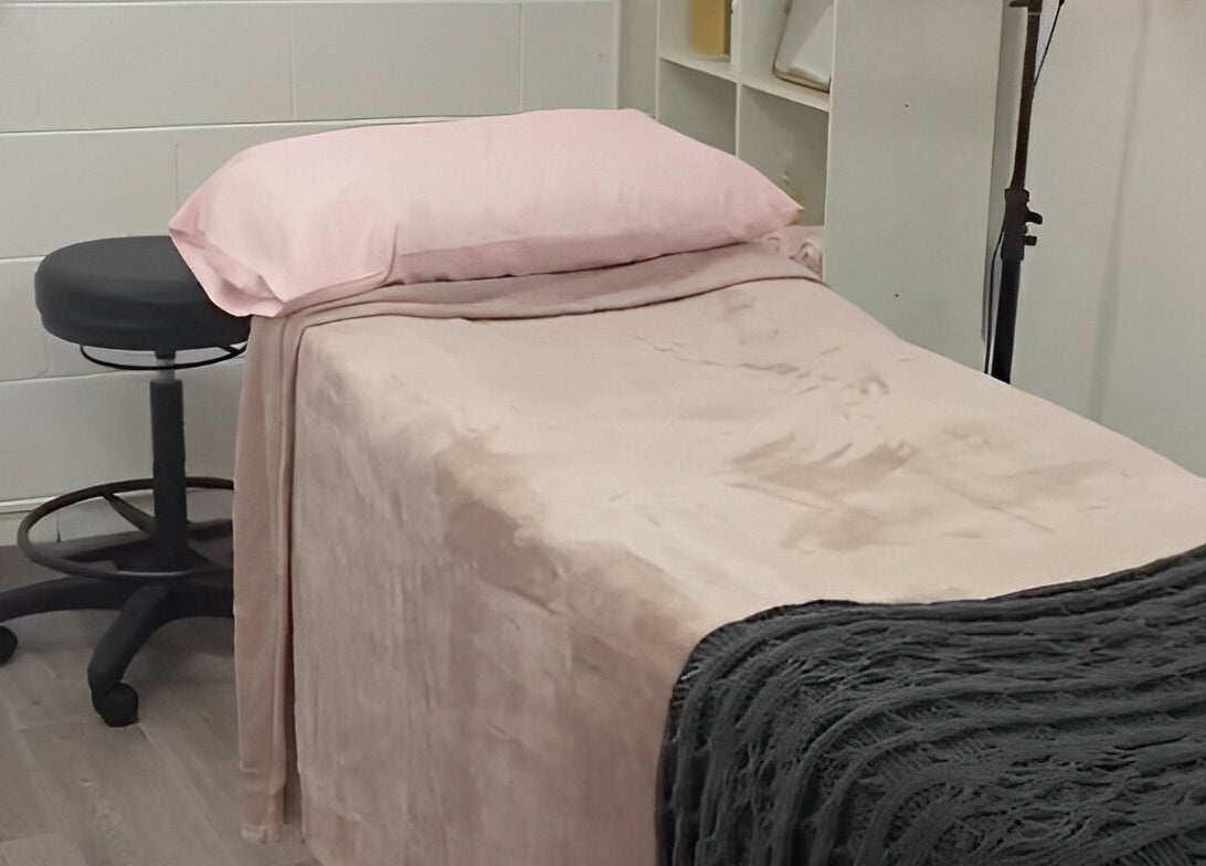 Cozy treatment room at Amabilia Beauty, Charmhaven, New South Wales, AU with a bed and stool.