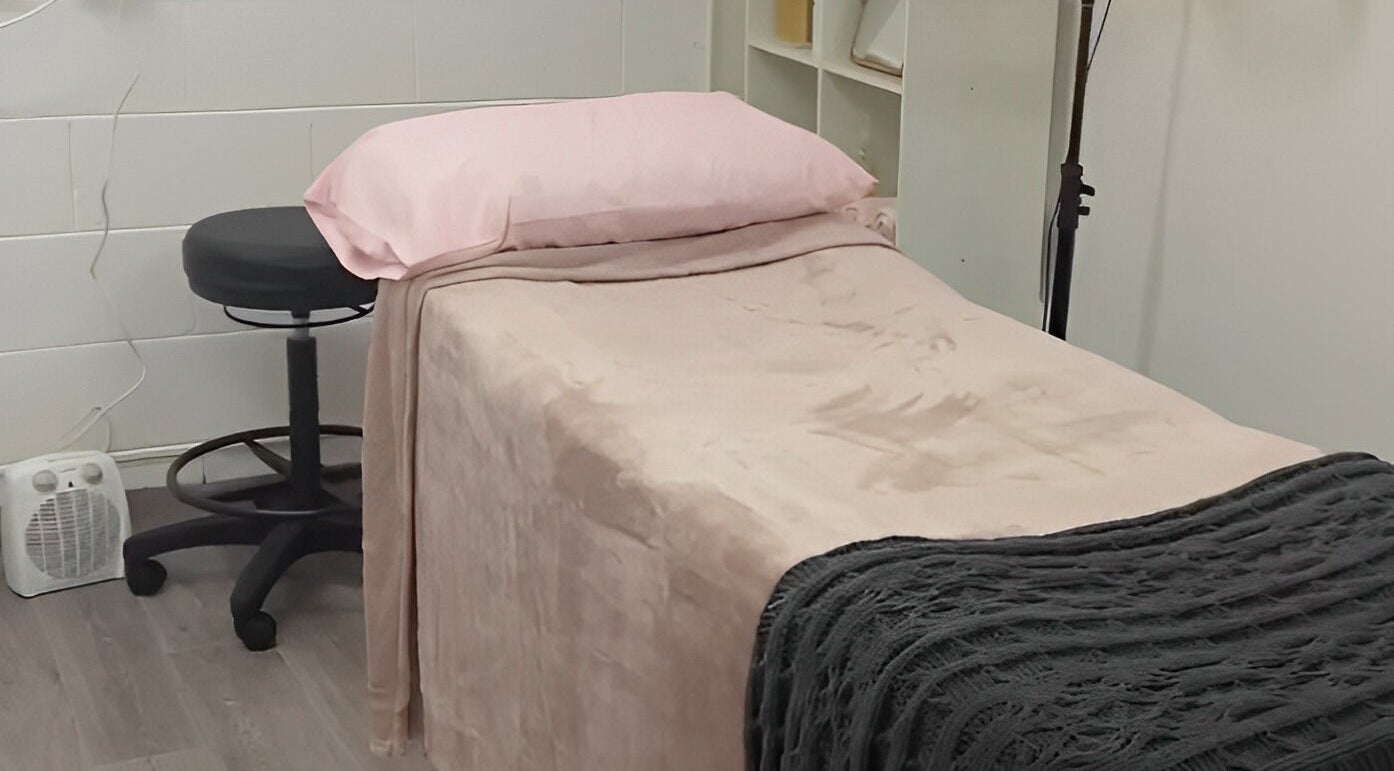 Cozy treatment room at Amabilia Beauty, Charmhaven, New South Wales, AU with a bed and stool.