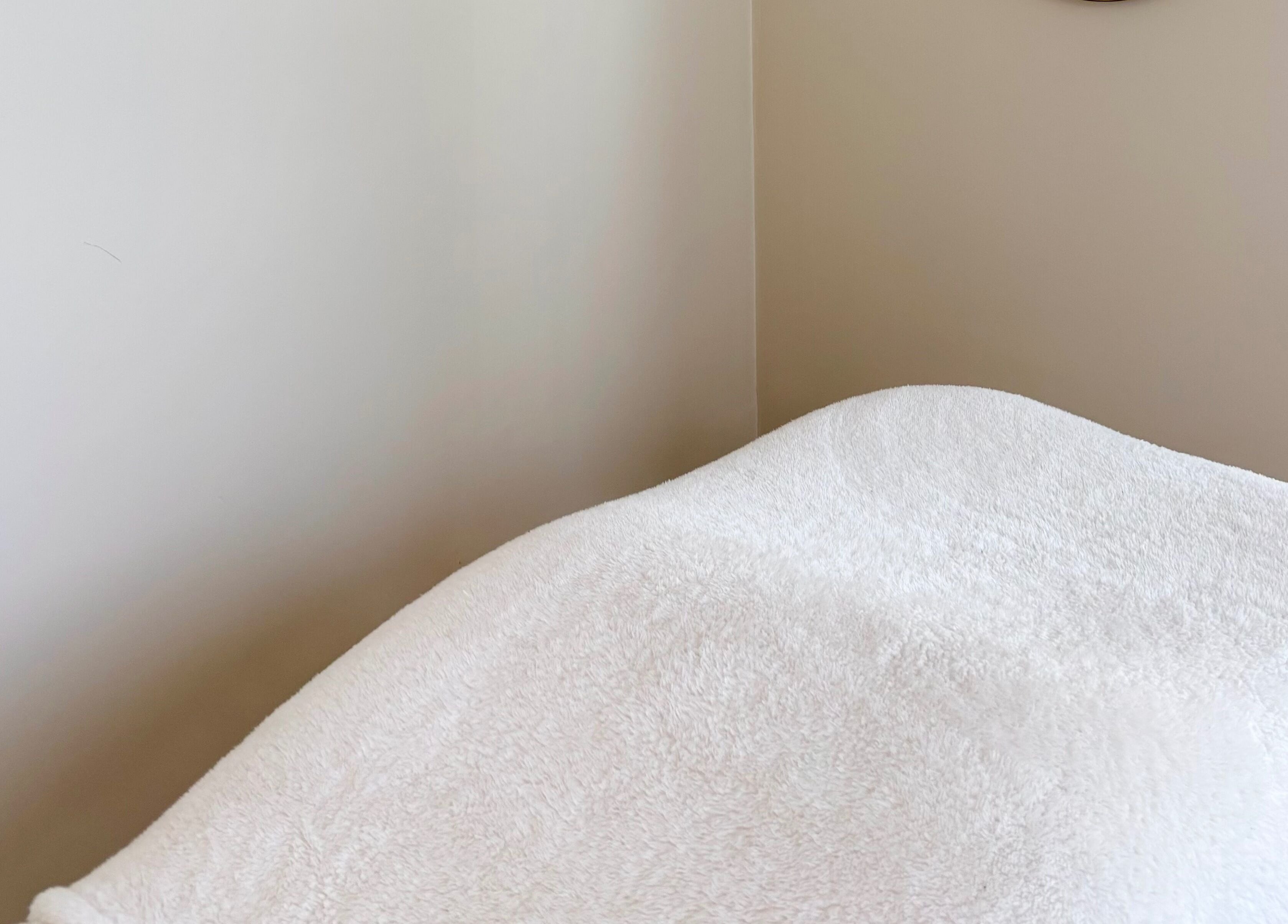 Cozy treatment bed at Base Beauty Studio, Burleigh Waters, Queensland, AU for relaxation and wellness.