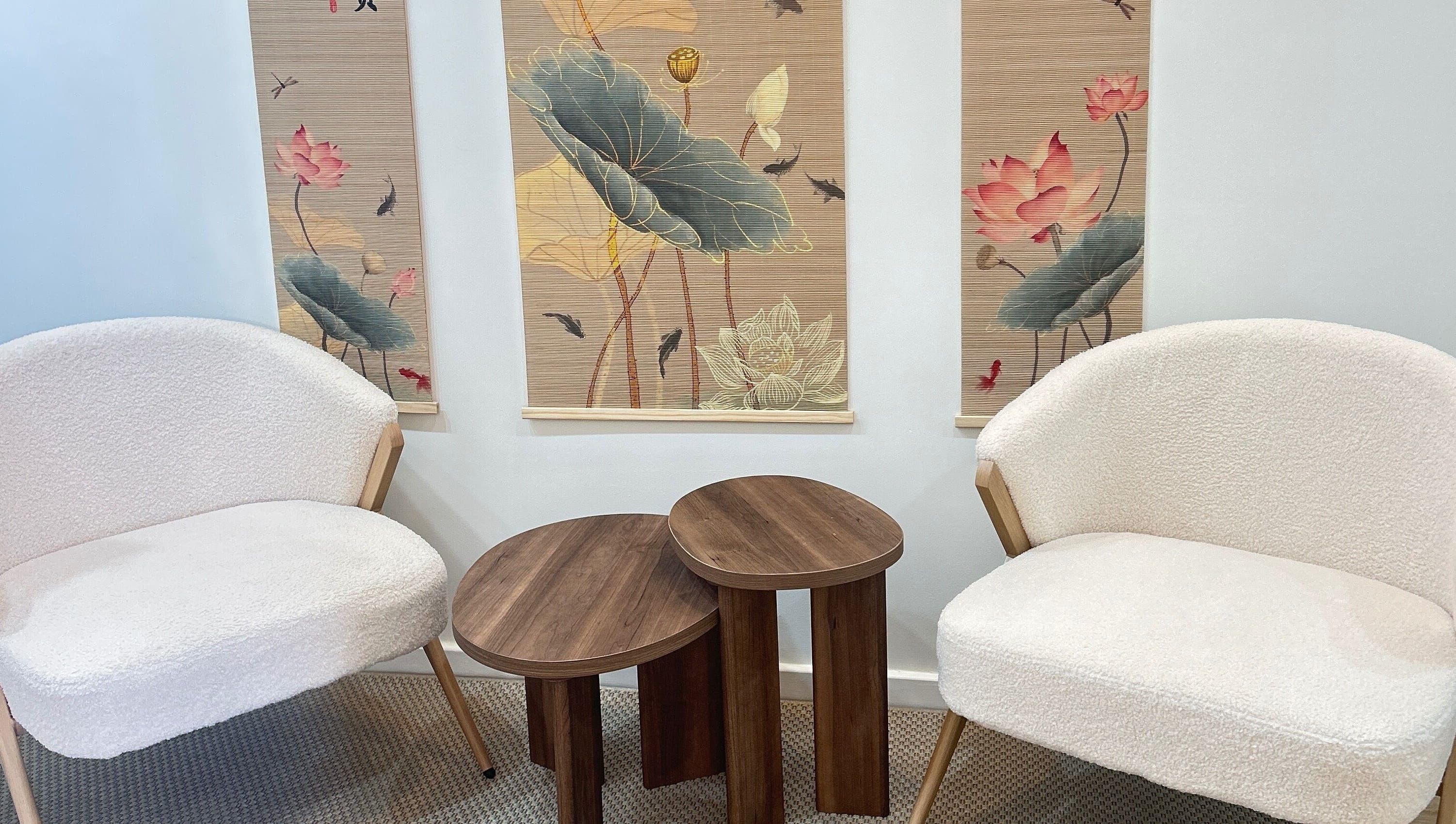 Elegant lounge at Lotus Crown Spa, Joondalup, WA, AU featuring plush chairs and lotus-themed decor.