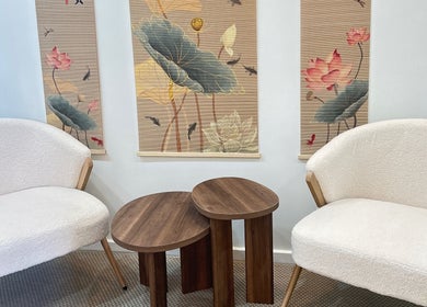 Elegant lounge at Lotus Crown Spa, Joondalup, WA, AU featuring plush chairs and lotus-themed decor.