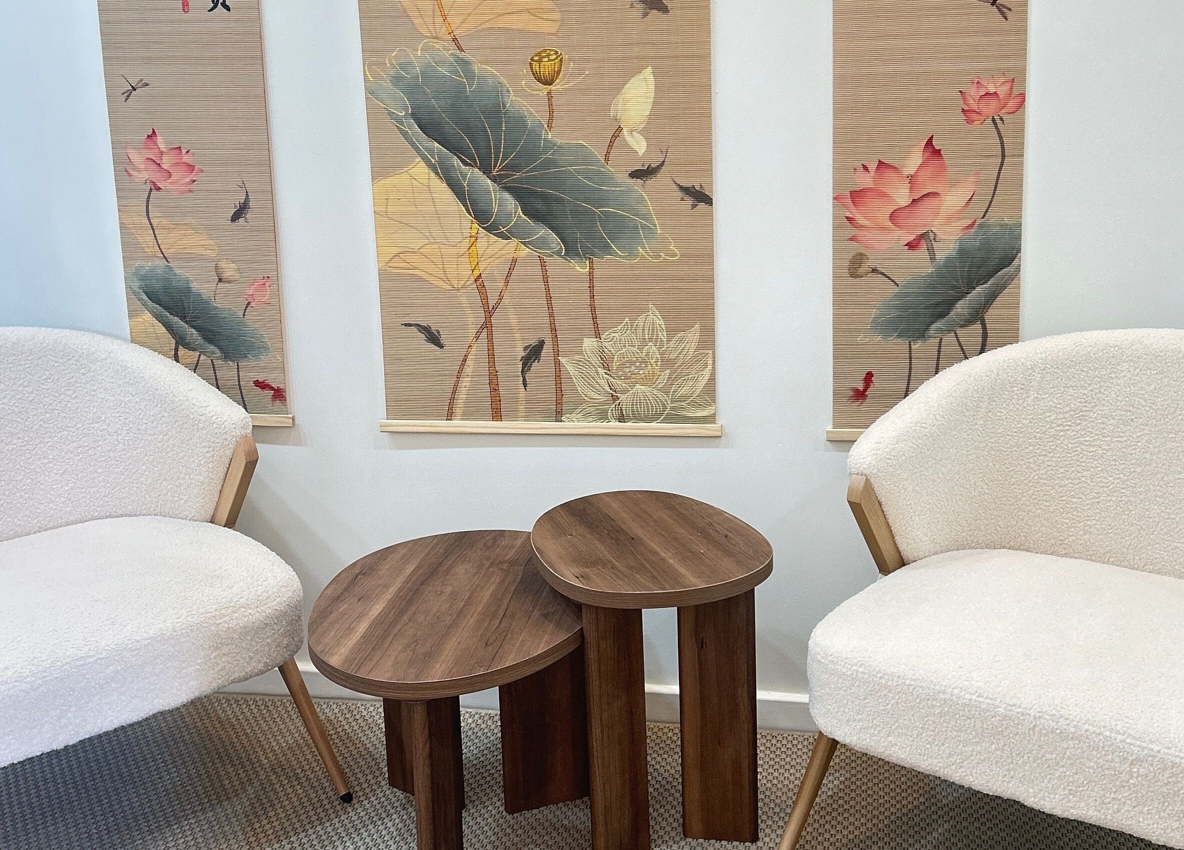 Elegant lounge at Lotus Crown Spa, Joondalup, WA, AU featuring plush chairs and lotus-themed decor.