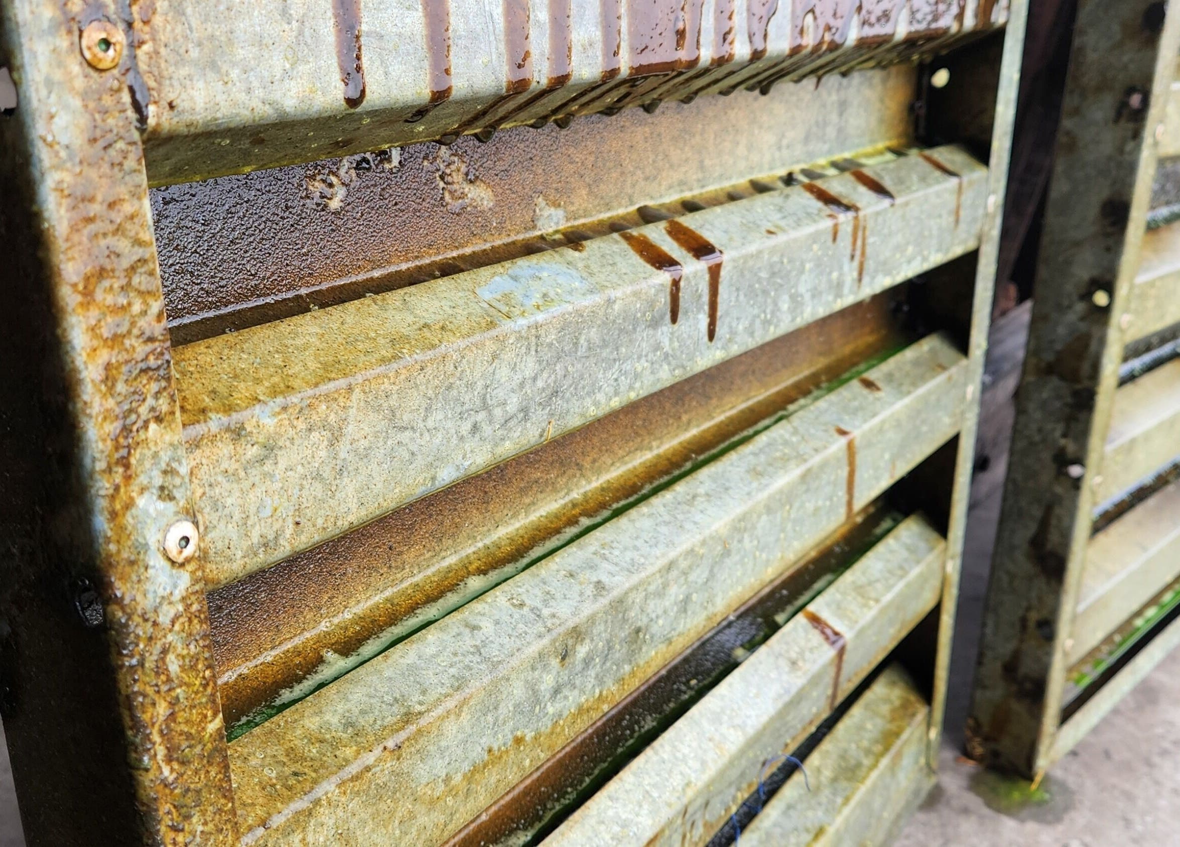 Close-up of rusted metal vents at MC Cleaning, Springs, Gauteng, ZA showcasing intricate textures.