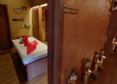 Tranquil massage room at Myo Thai Spa, Ooty, Tamil Nadu, IN showcasing relaxation essentials.
