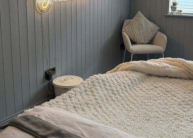 Inviting treatment room at Beauty By Jaden in North Shields, England, GB, featuring a plush bed and modern decor.