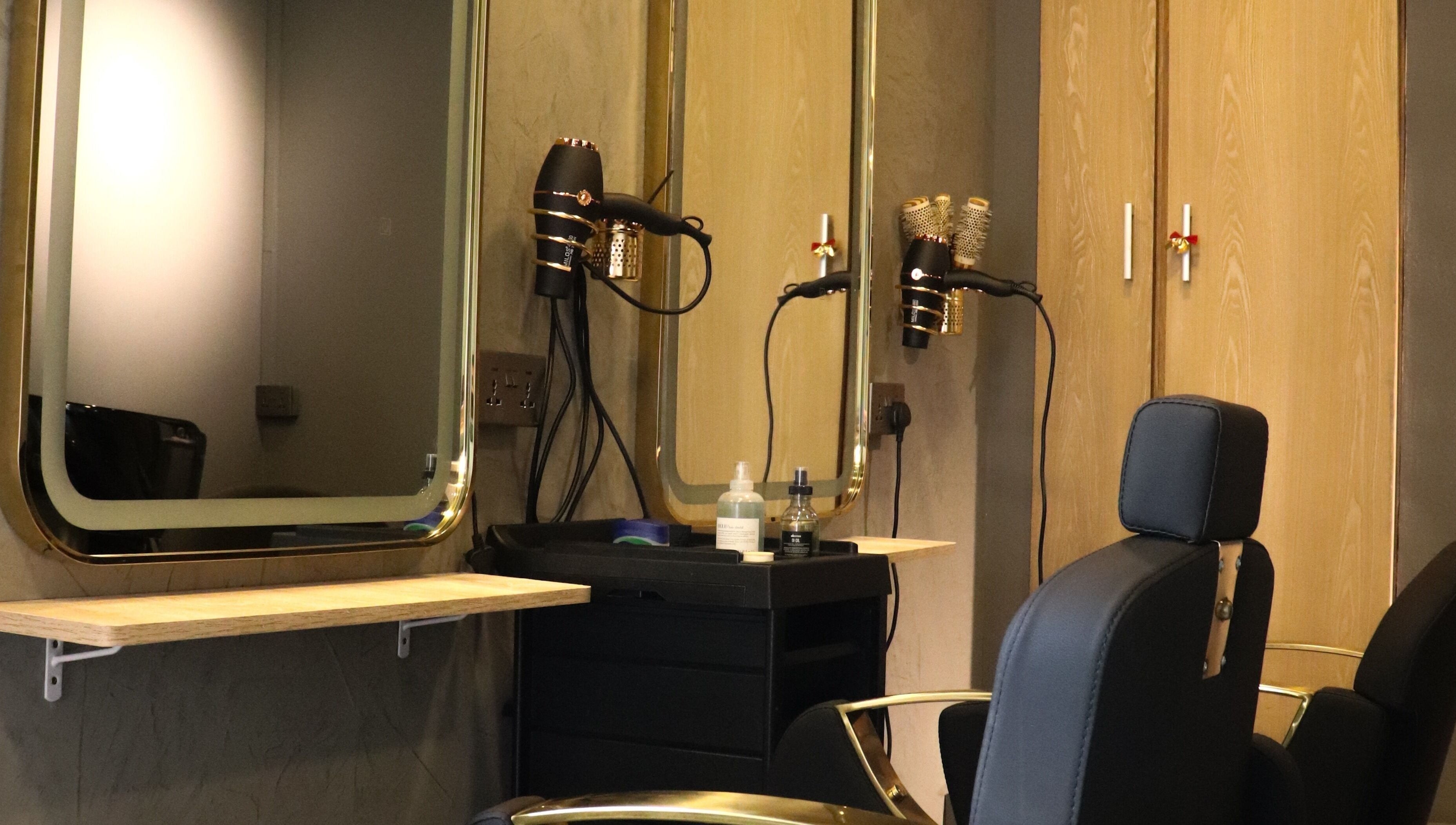 Modern salon station at Aesthe in Port Louis, Port Louis District, MU with styling tools and mirrors.