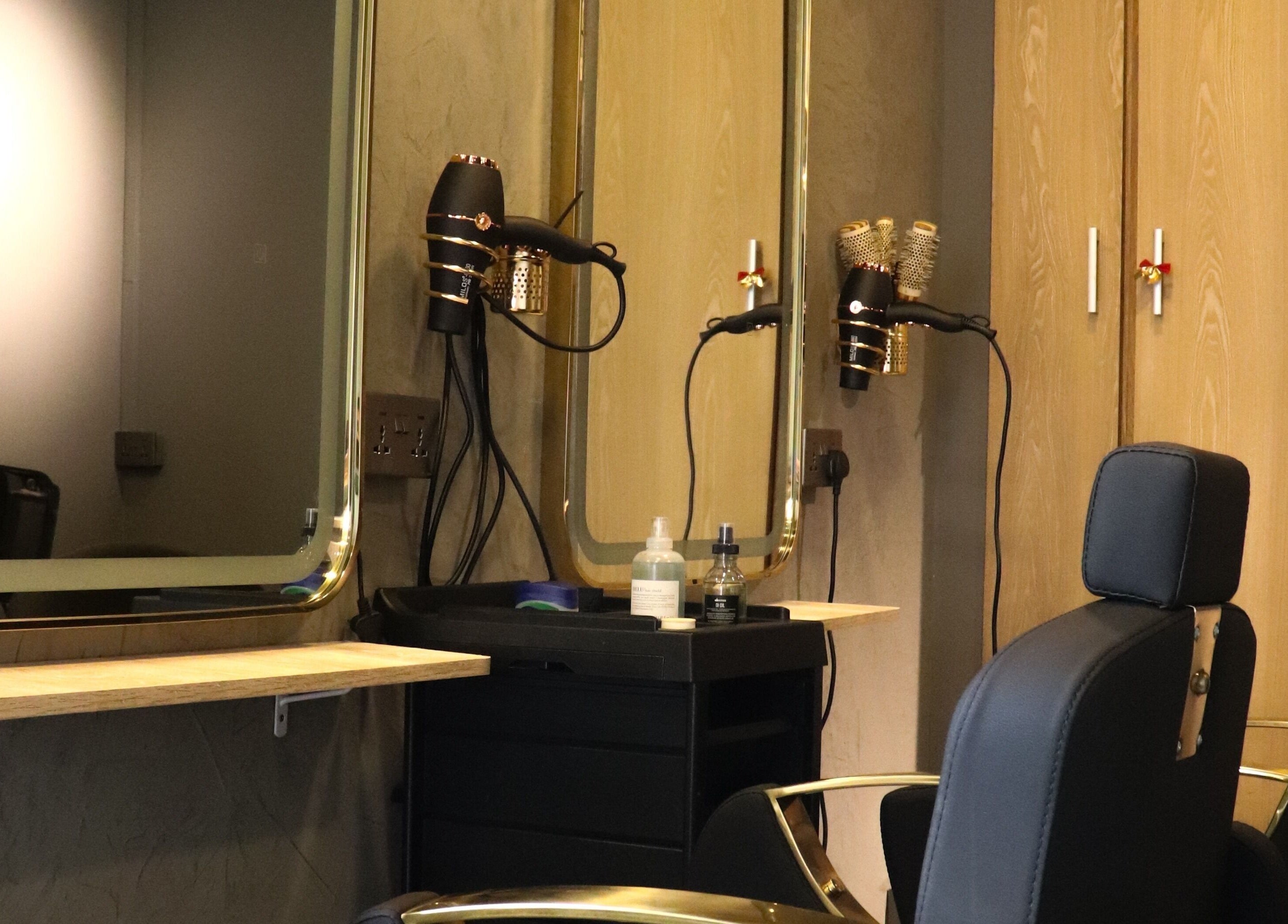 Modern salon station at Aesthe in Port Louis, Port Louis District, MU with styling tools and mirrors.