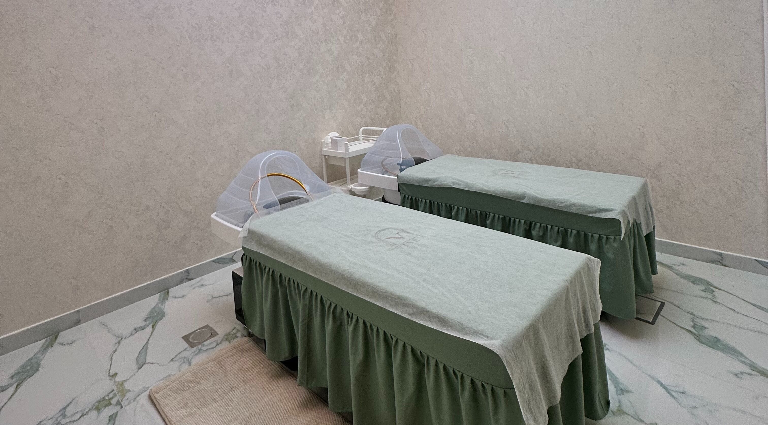 Two massage beds at Vines Hair Care, Dubai, Dubai, AE, providing a tranquil wellness experience.