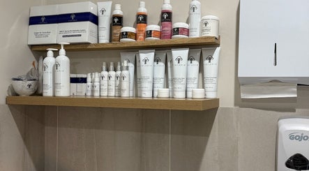 Variety of skincare products displayed on wooden shelves at Skin By Sar, Seymour, Victoria, AU.