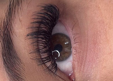 Close-up of enhanced eyelashes at Butterfly Beauty, Rugby, England, GB showcasing detailed extensions.