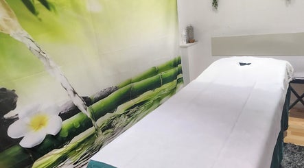 Peaceful spa room with massage bed at K. Thai Massage Holistic, Cleckheaton, England, GB.