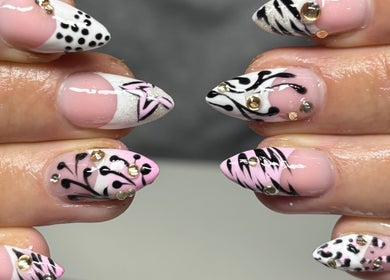 Stylish nail art with black patterns and gems at Pretty Nuisance Artistry, Baldivis, Western Australia, AU.