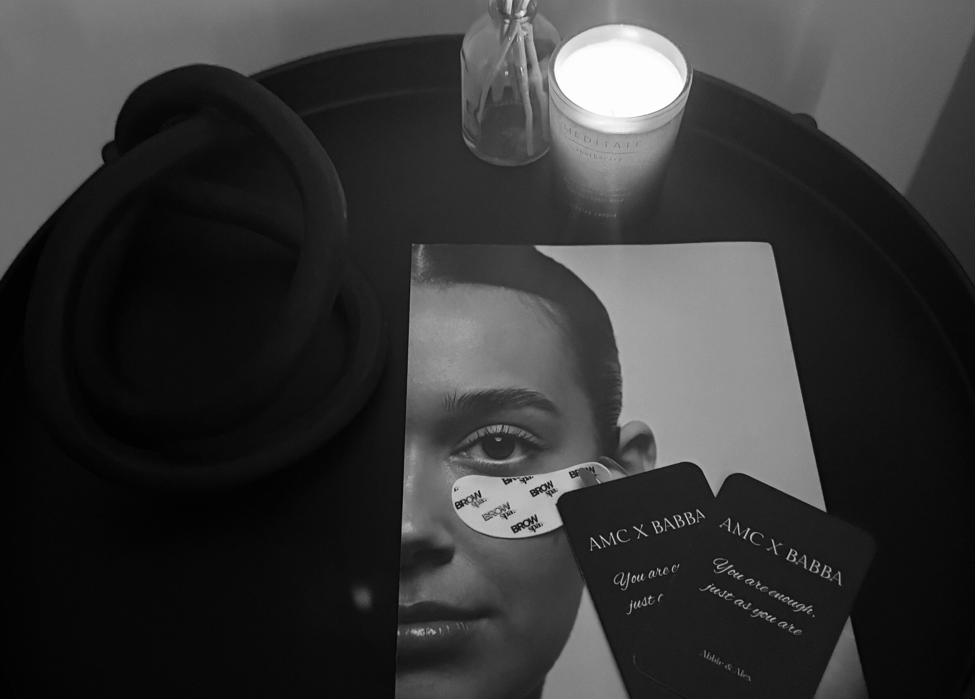 Candle, brochure, and cards at The Brow Bar, Inverurie, Scotland, GB; a calming beauty and wellness vibe.