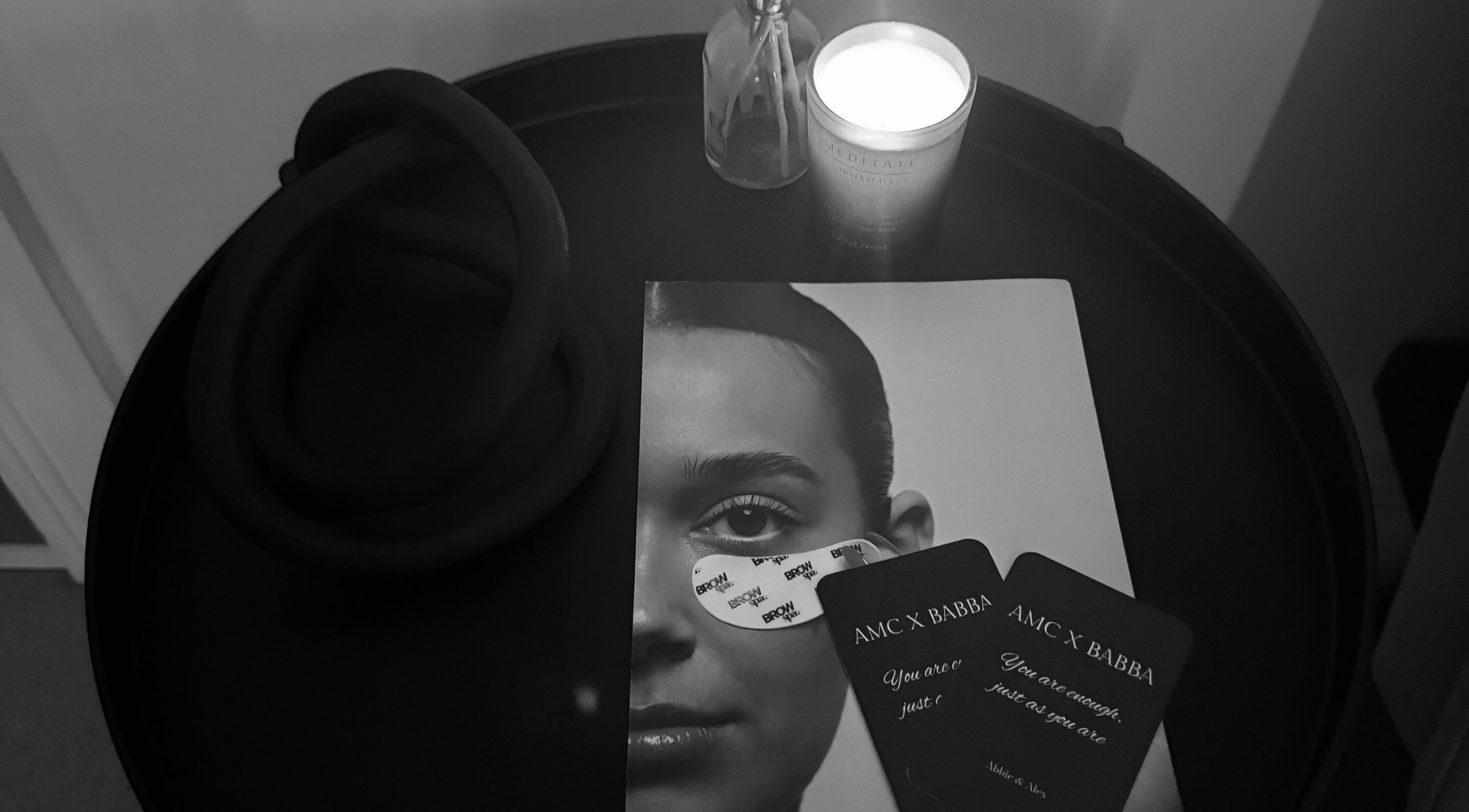 Candle, brochure, and cards at The Brow Bar, Inverurie, Scotland, GB; a calming beauty and wellness vibe.