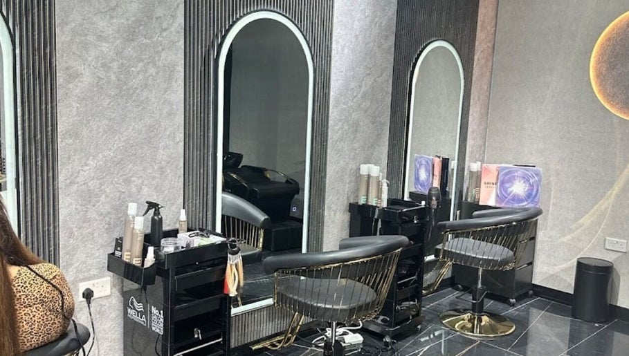 Chic interior of The Luxury Touch Beauty Salon, Dubai, Dubai, AE, featuring stylish chairs and mirrors.