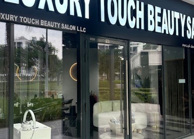 Front view of The Luxury Touch Beauty Salon in Dubai, Dubai, AE showcasing its elegant glass entrance.