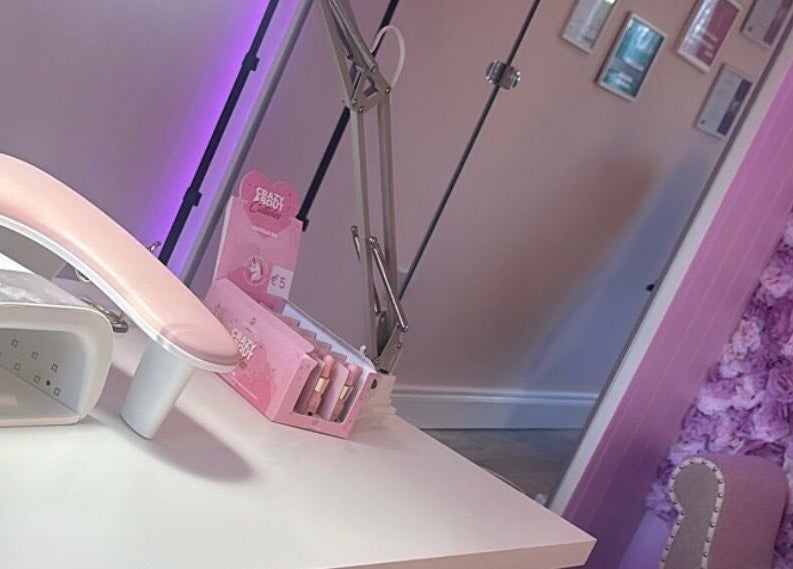 Nail station at Amy’s Beauty Aesthetics, County Meath/ Kildare, IE with pink decor and nail tools.