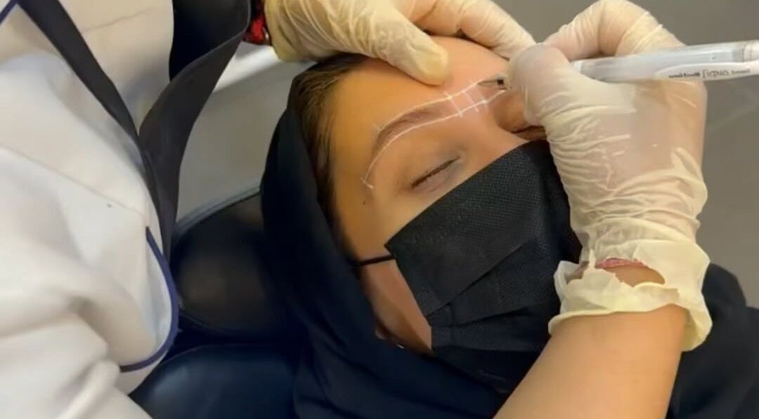 Eyebrow shaping at The Browz Salon in Zayed Town, Al-muḥāfaẓat Aš-šamālīyah, BH by a skilled beautician.