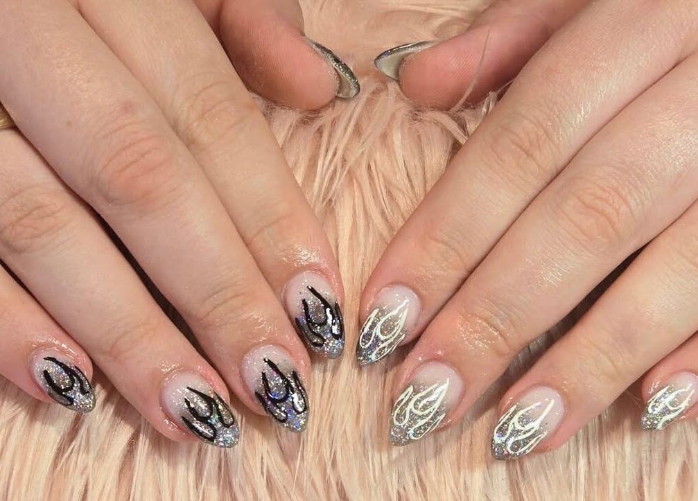 Intricate nail art design with glitter at Kiwiinails Pro, Fenton, Michigan, US.