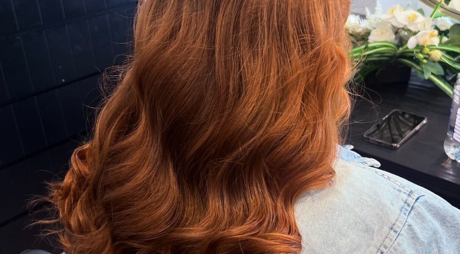Lustrous auburn hair styled in waves at Magnolia Beauty Bar in Mildura, Victoria, AU.