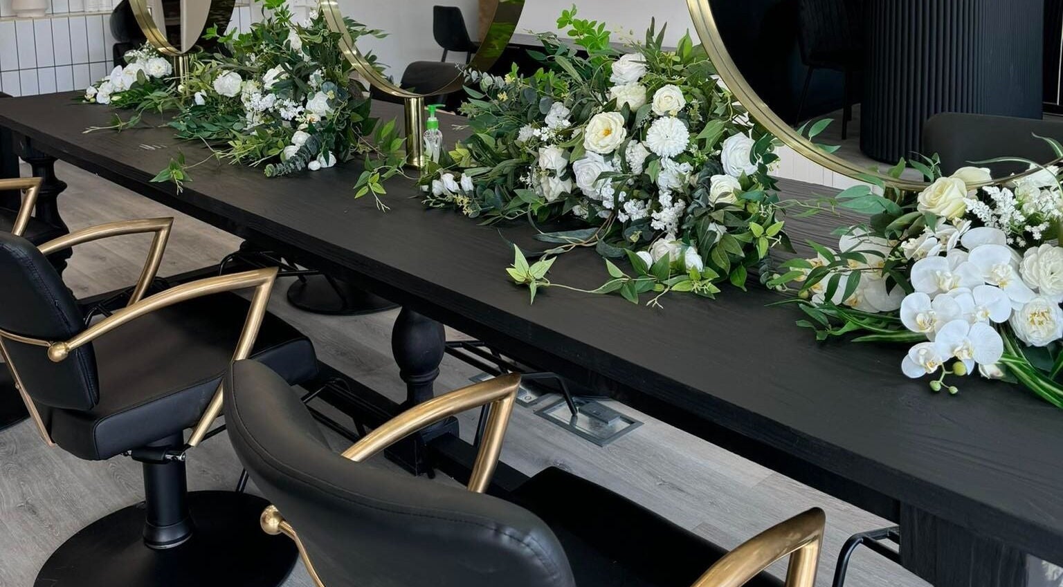 Stylish salon chairs and floral decor at Magnolia Beauty Bar, Mildura, Victoria, AU.