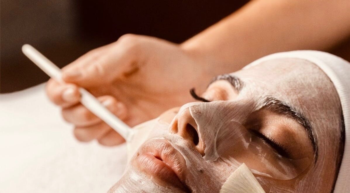 A woman receives a facial mask treatment at The Cosmetic Collective, Palo Alto, California, US.
