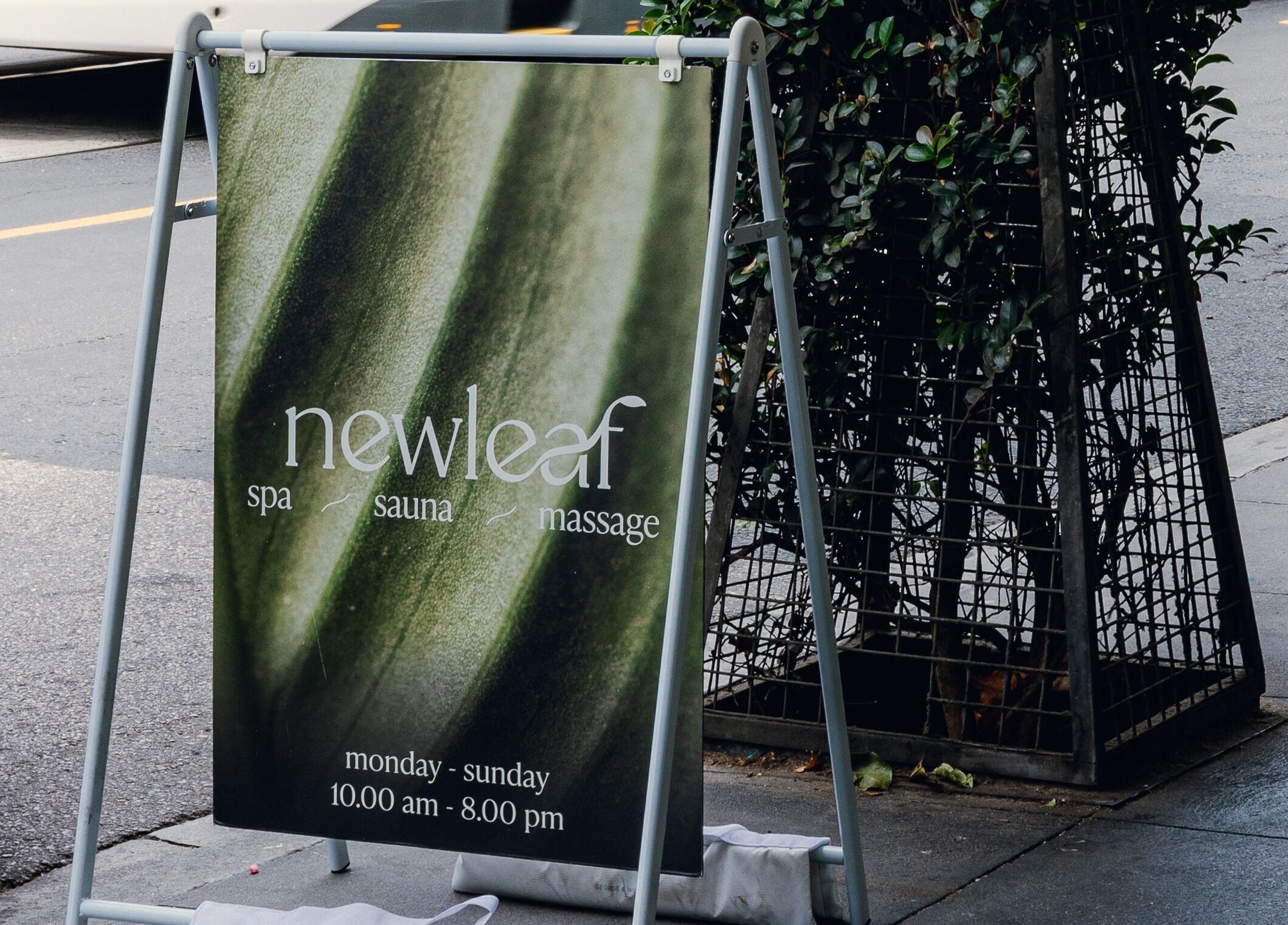 Newleaf Spa street sign in Melbourne, Victoria, AU welcoming guests for spa, sauna, and massage services.