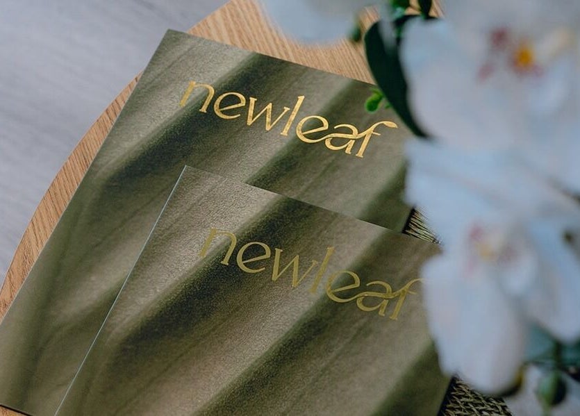 Elegant Newleaf Spa brochures on a table in Melbourne, Victoria, AU.