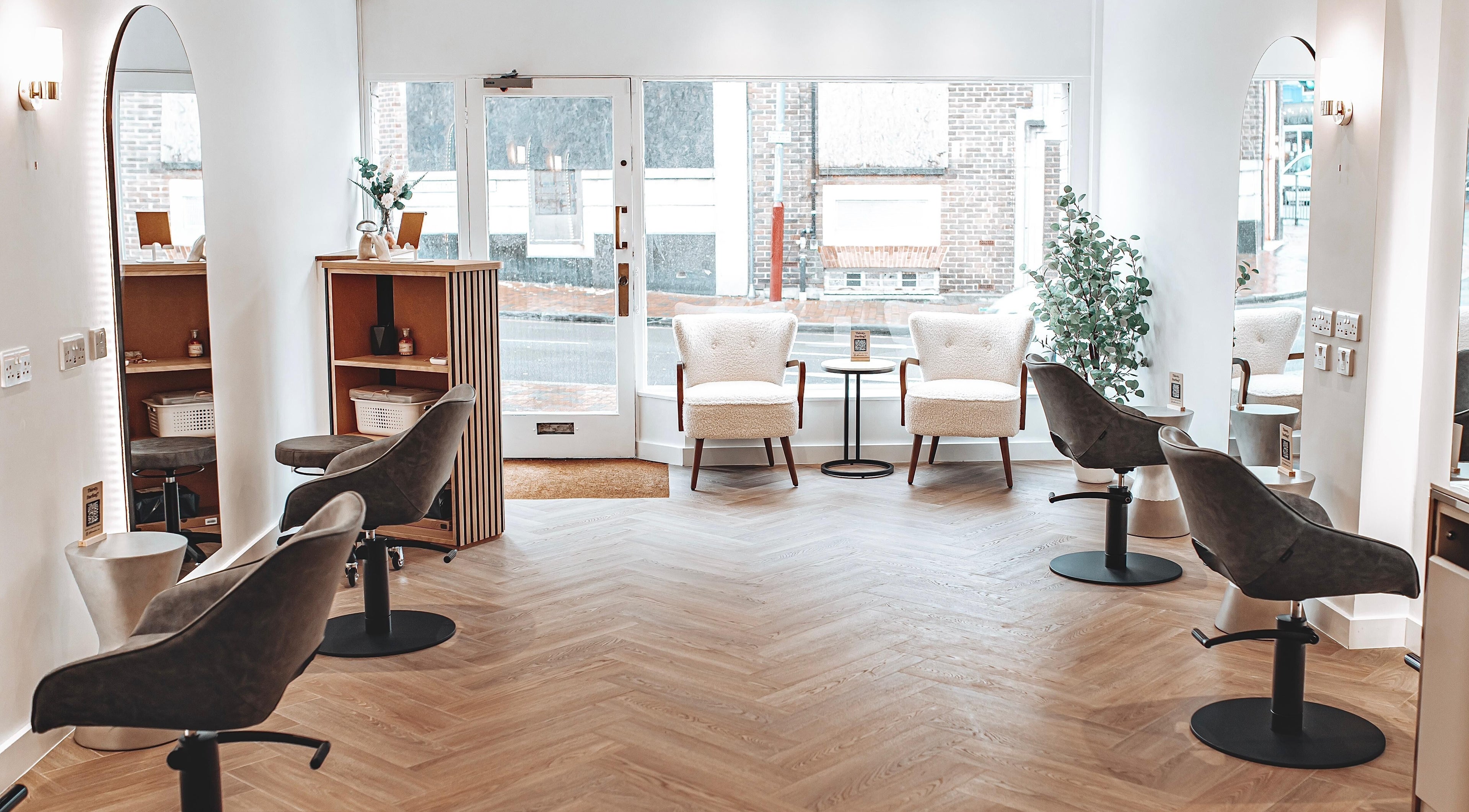 Relaxing interior of Flow, Royal Tunbridge Wells, England, GB, featuring modern chairs and elegant decor.