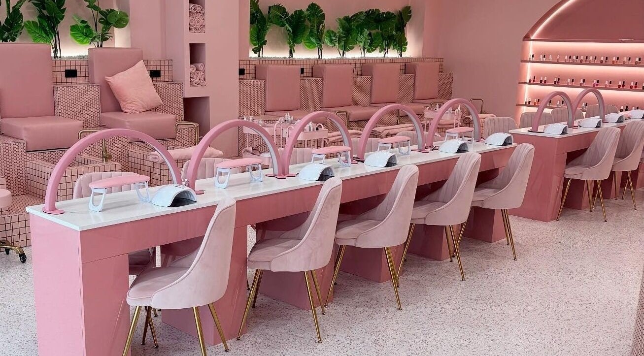 Interior of She Loves Pink salon in Bondi Junction, New South Wales, AU, featuring elegant pink decor and plush seating.