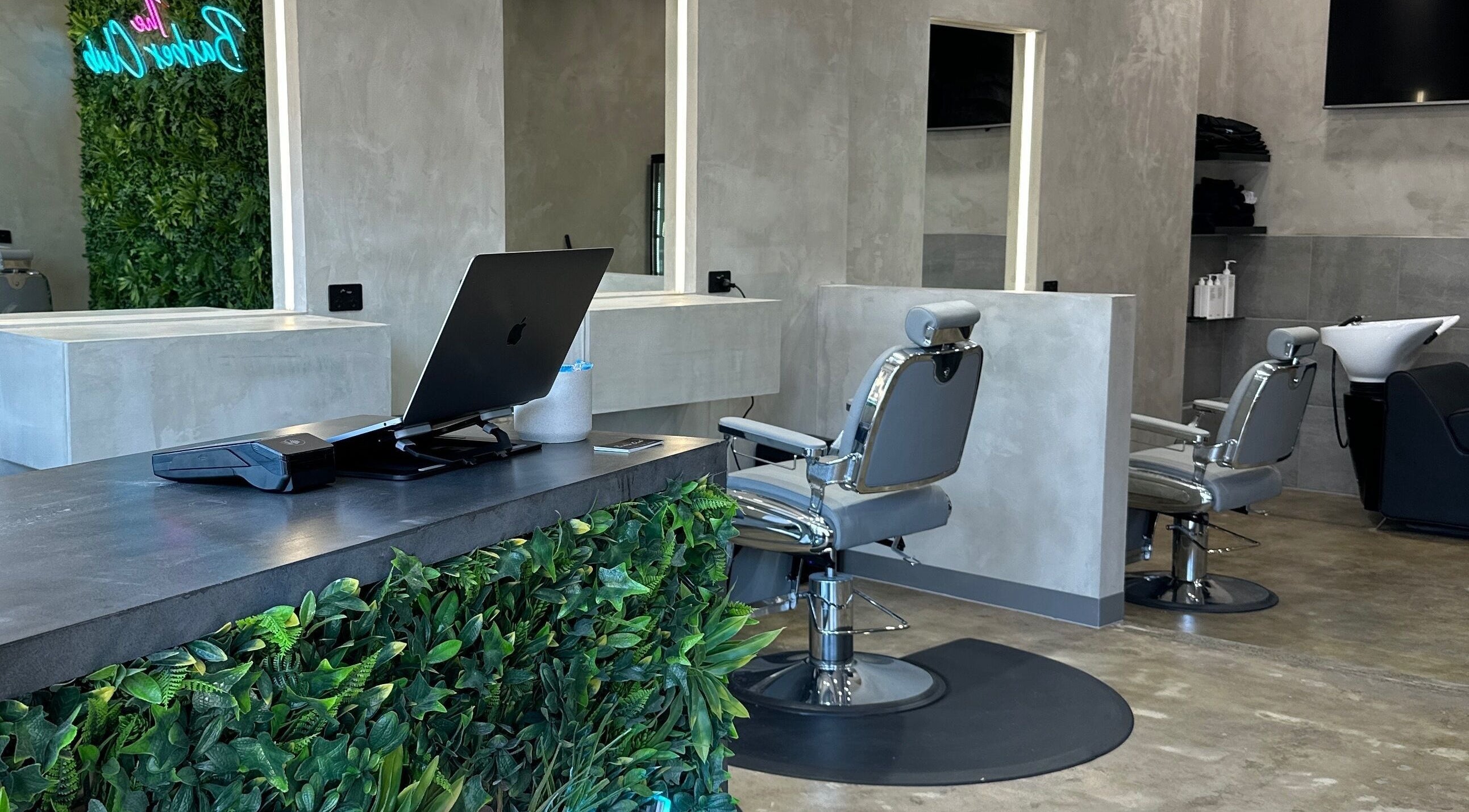 Interior of The Barber Club Ringwood, Melbourne, featuring sleek chairs and modern decor.
