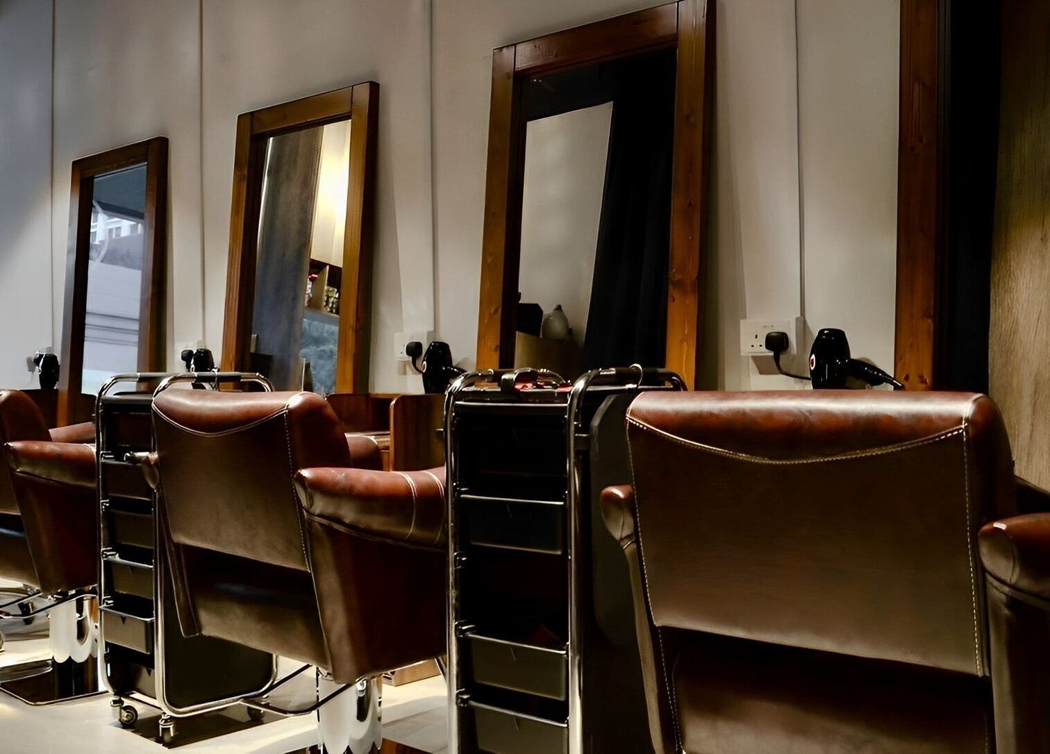 Elegant salon chairs and mirrors at Hair Eclipse, Singapore, Singapore, SG for premium beauty services.