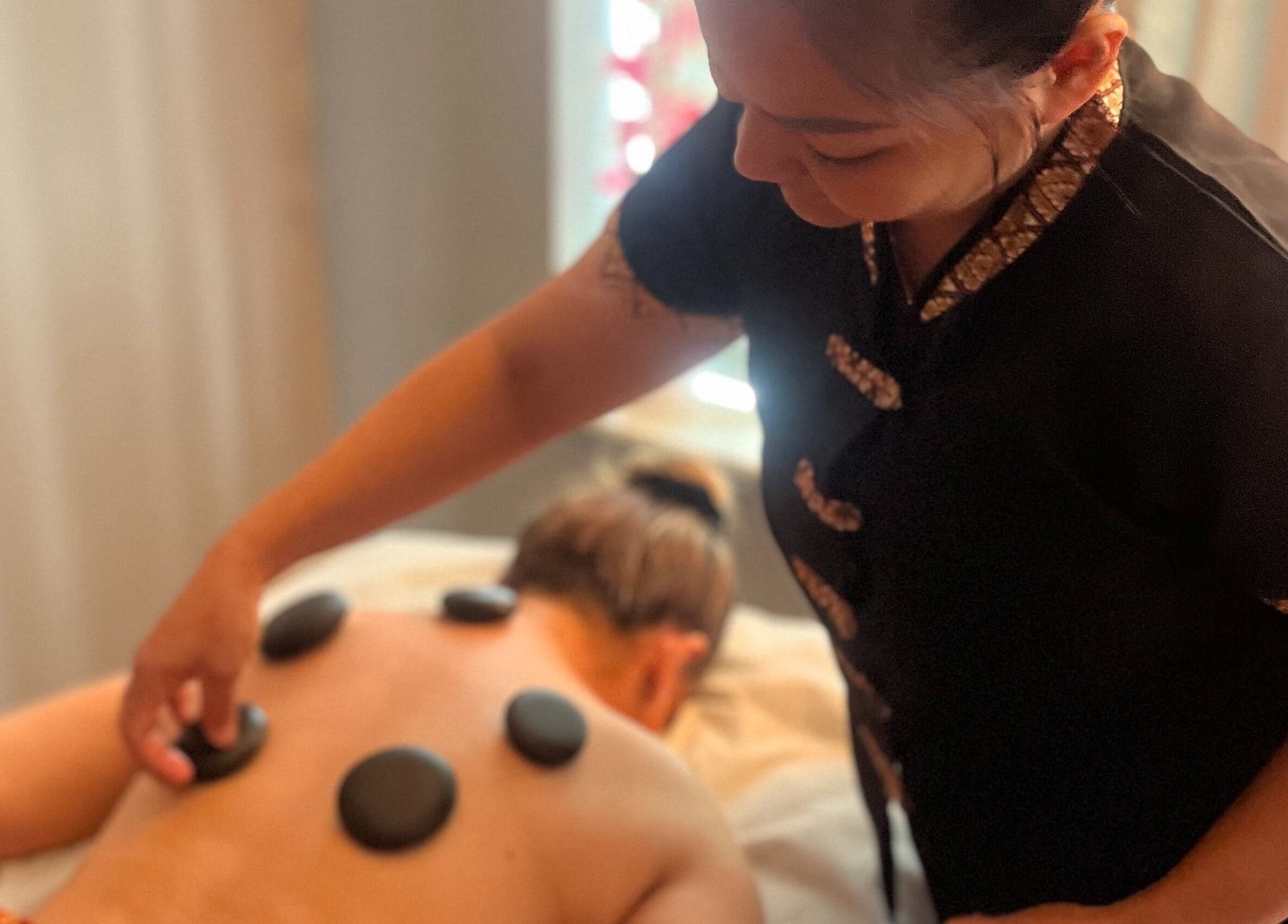 Relaxing hot stone massage at Serenity Thai Massage, Sligo, County Sligo, IE, promoting wellness and tranquility.