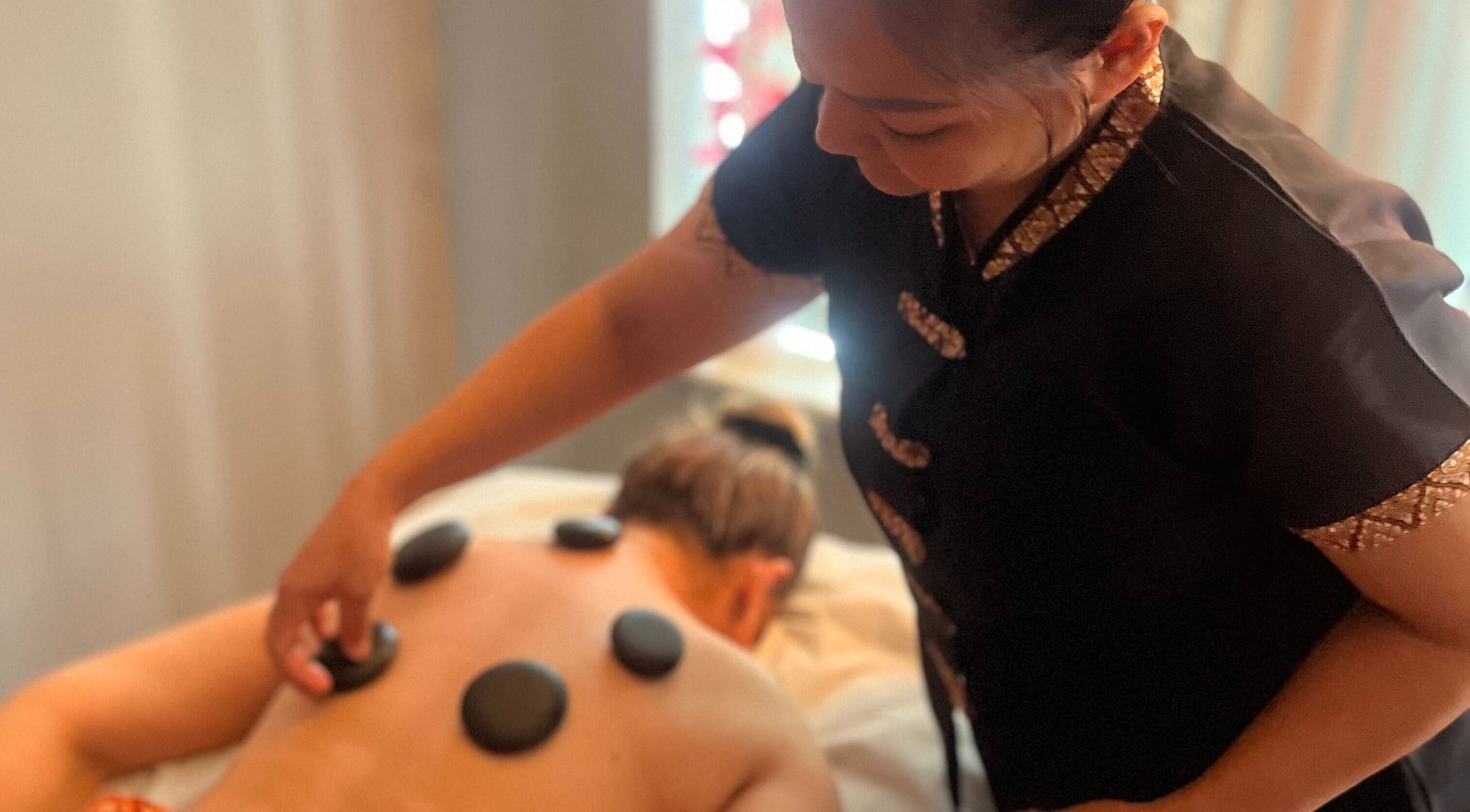 Relaxing hot stone massage at Serenity Thai Massage, Sligo, County Sligo, IE, promoting wellness and tranquility.