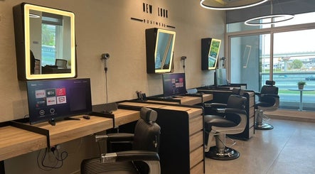 Modern salon interior at New Look Business, Dubai, Dubai, AE, featuring stylish workstations and mirrors.