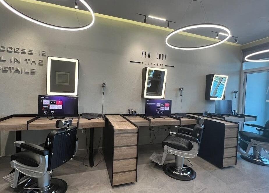 Modern salon chairs and mirrors at New Look Business, Dubai, Dubai, AE, exemplifying elegance in beauty services.