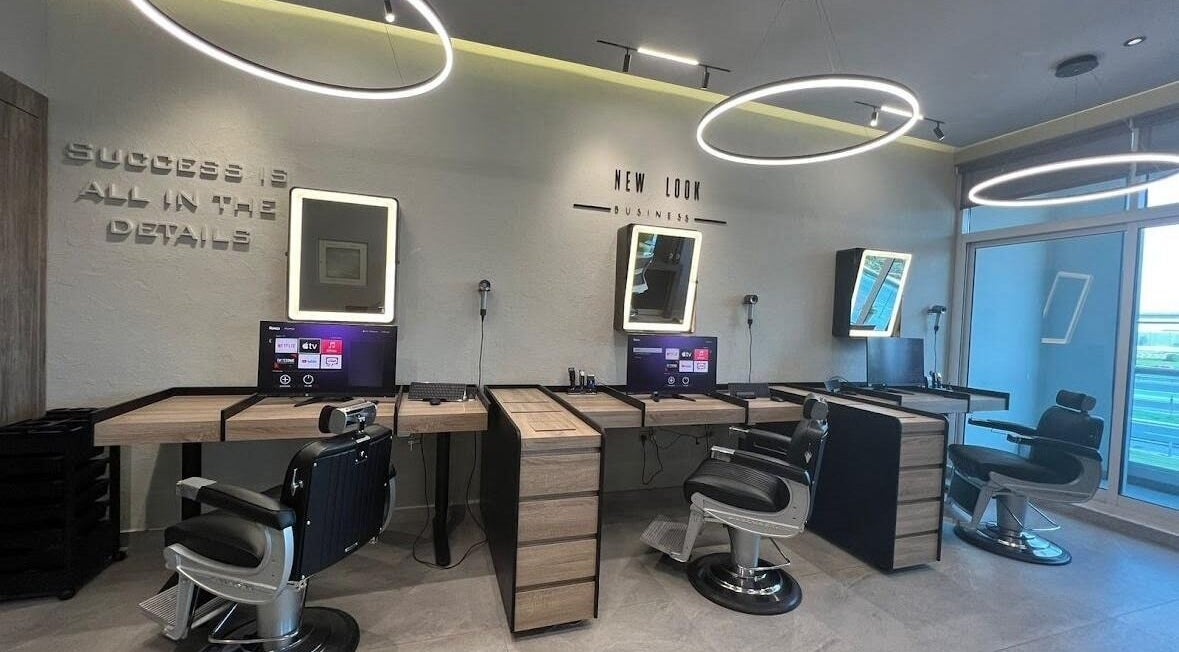 Modern salon chairs and mirrors at New Look Business, Dubai, Dubai, AE, exemplifying elegance in beauty services.