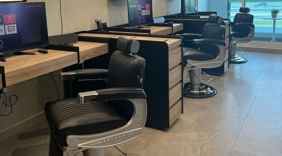 Modern barber chairs at New Look Business in Dubai, Dubai, AE, highlighting sleek design and comfort.