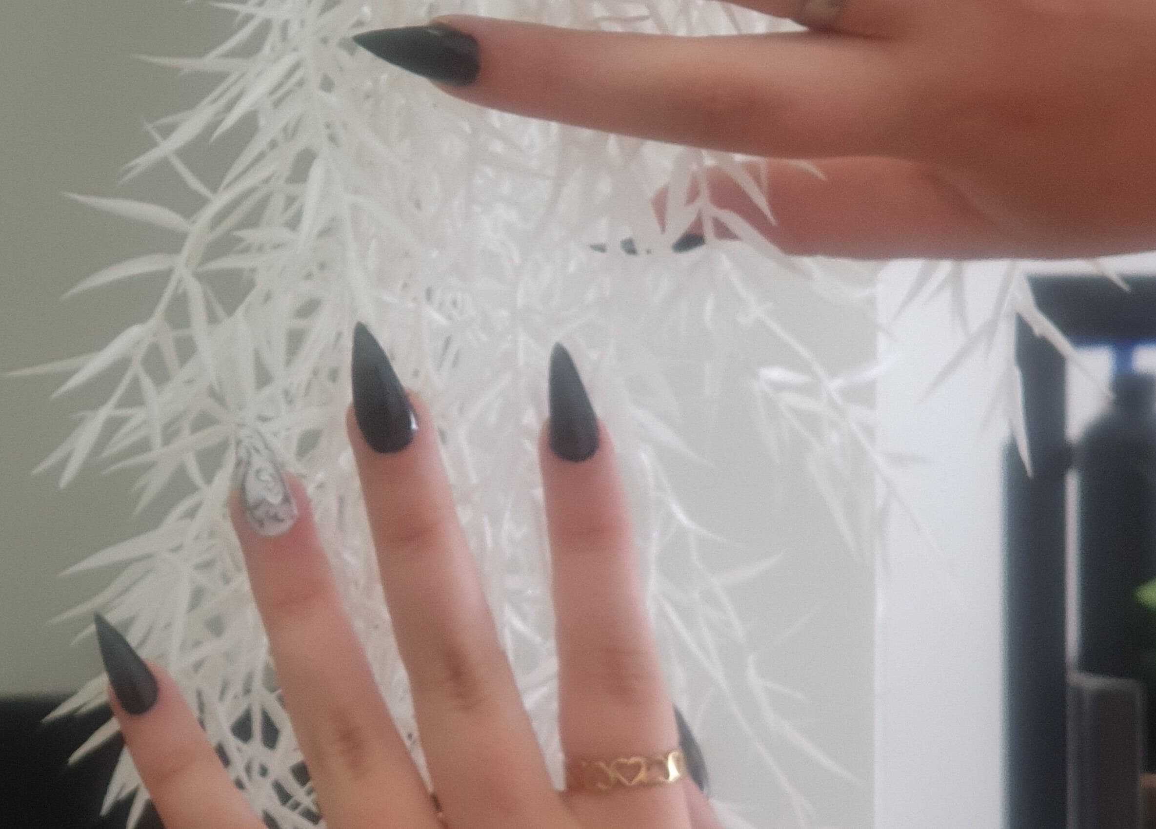 Stylish black nails with ring at BeBe, Cape Town, Western Cape, ZA. Featuring modern geometric art.