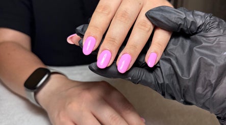 Bright pink manicure at The Nail Vault in Plymouth, England, GB, showcasing expert nail care.