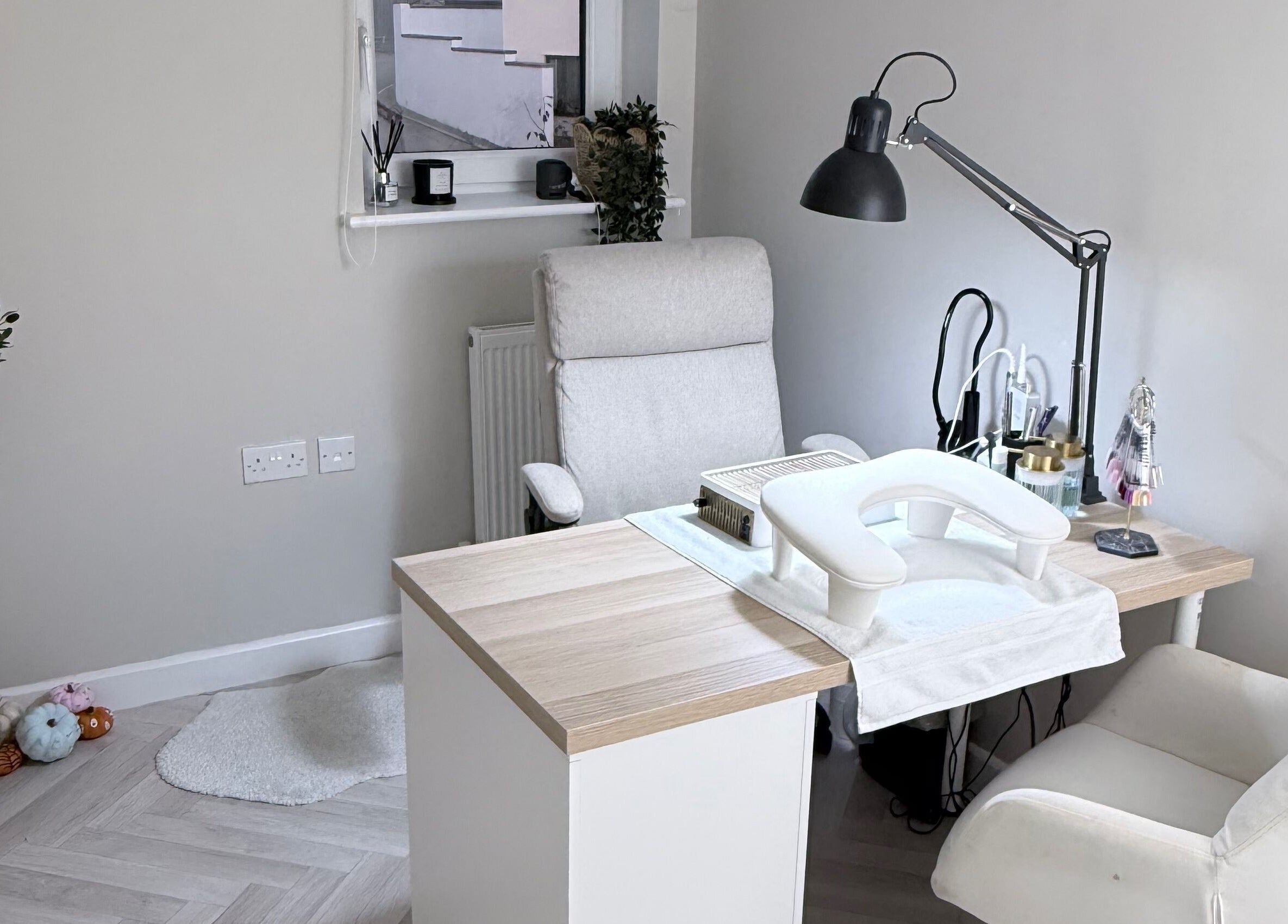 Elegant nail treatment room at The Nail Vault in Plymouth, England, GB, featuring a comfortable chair and table setup.