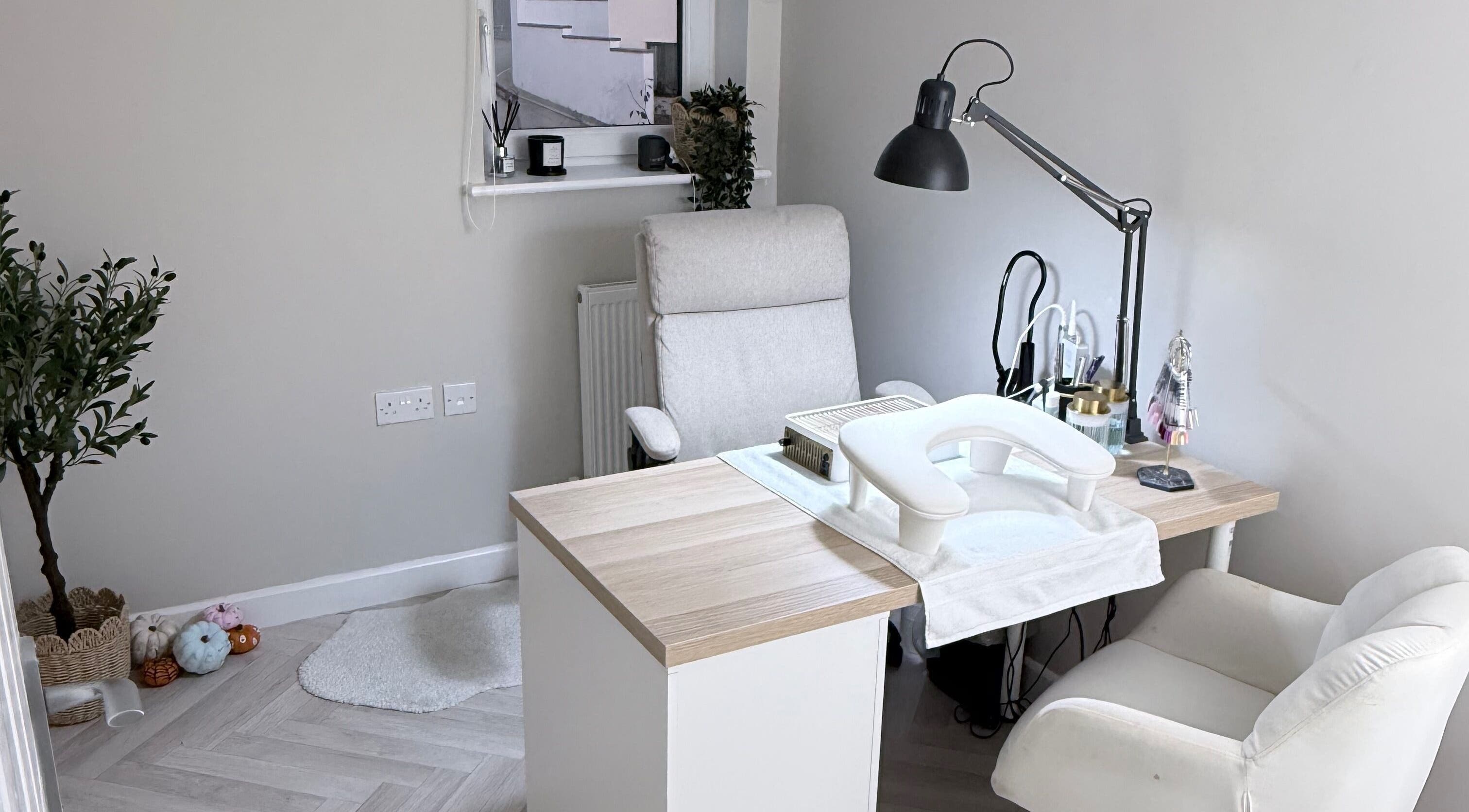 Elegant nail treatment room at The Nail Vault in Plymouth, England, GB, featuring a comfortable chair and table setup.