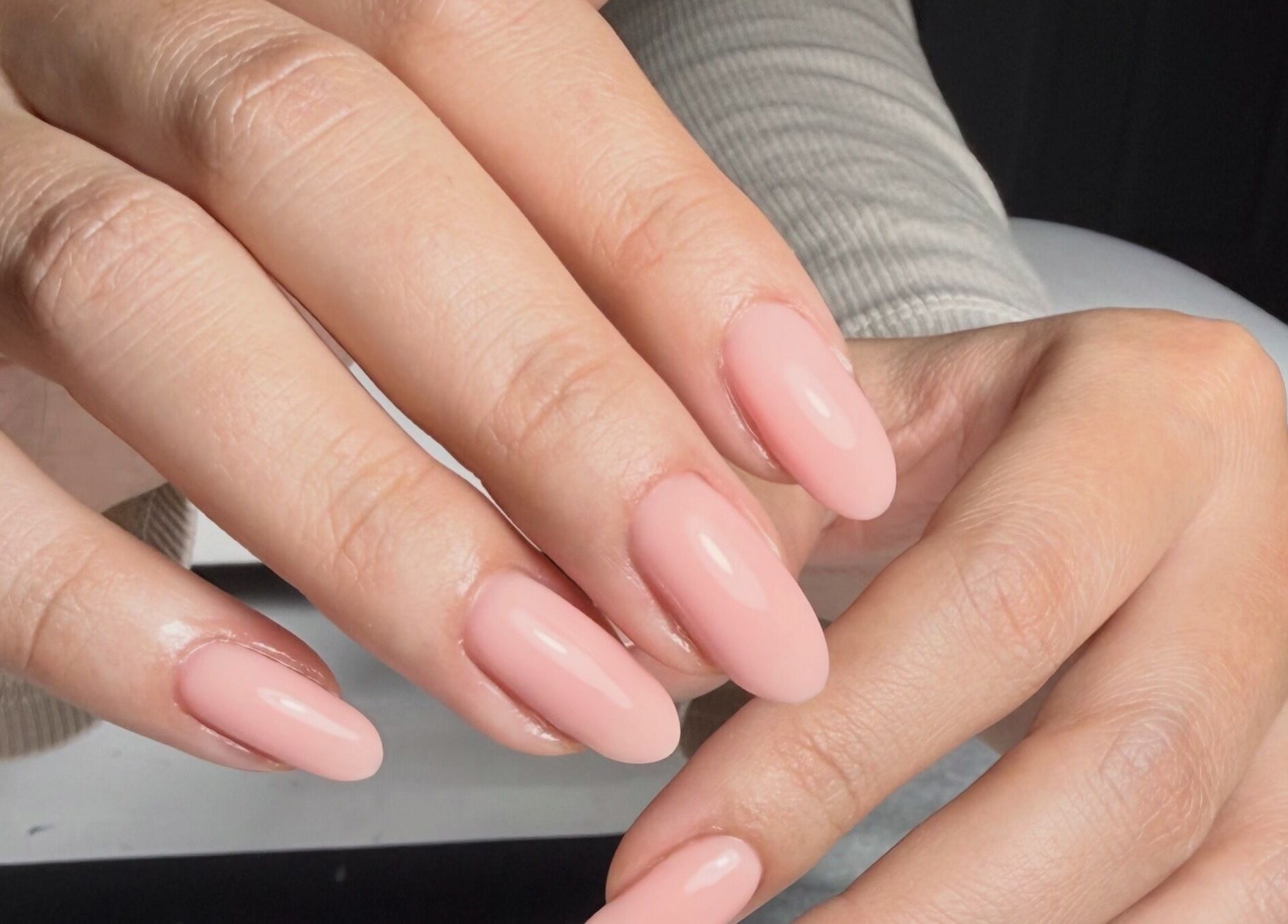 Elegant fresh pink manicure at The Nail Vault, Plymouth, England, GB, showcasing flawless nail art.