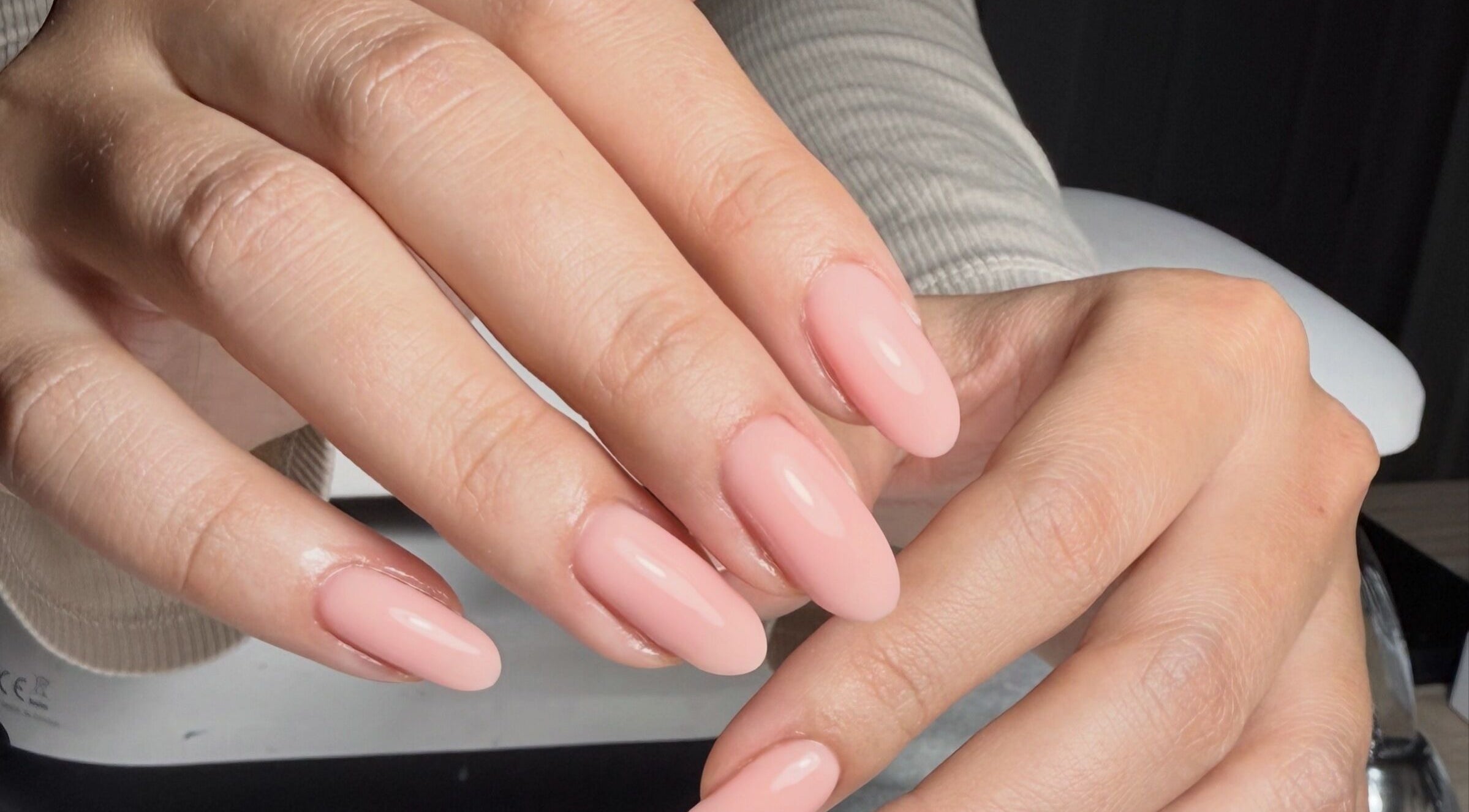 Elegant fresh pink manicure at The Nail Vault, Plymouth, England, GB, showcasing flawless nail art.