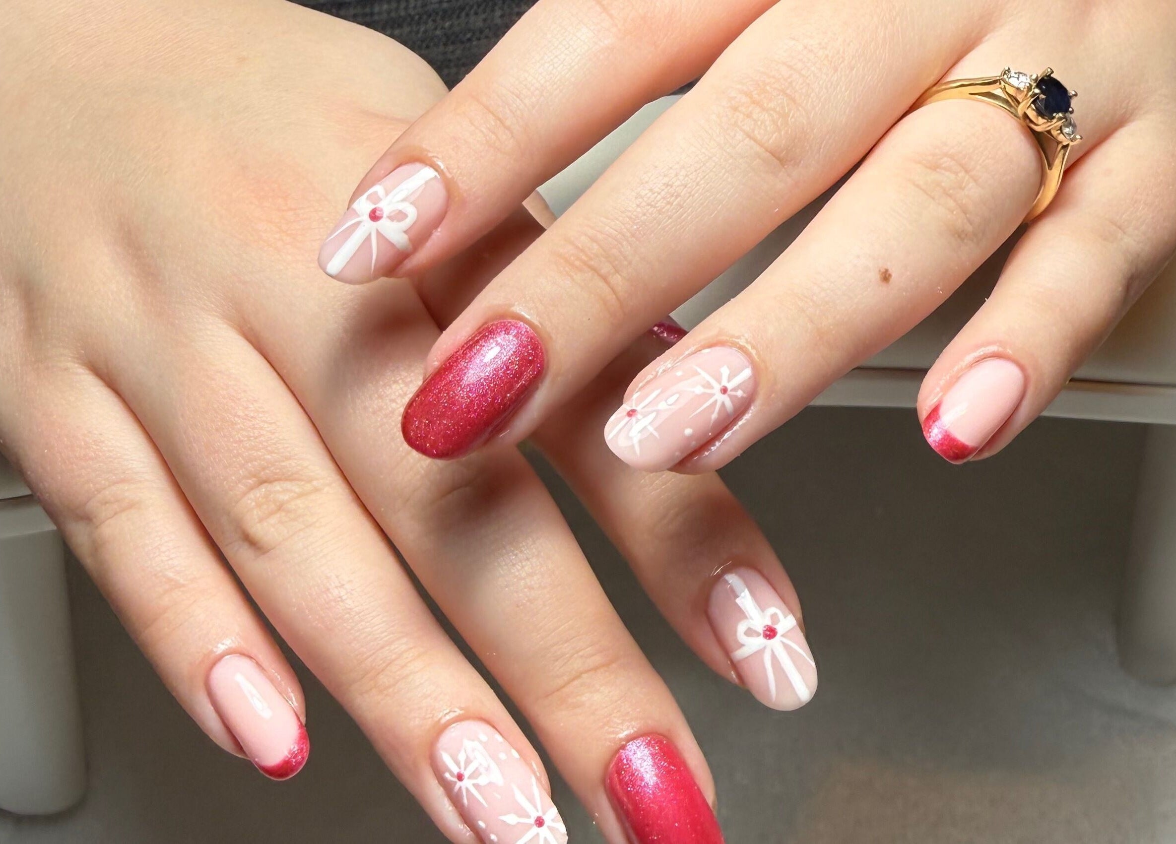 Elegant festive nail design from The Nail Vault in Plymouth, England, GB, featuring intricate patterns.