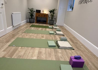 Yoga mats in serene studio at Claire Elliott Coaching & Yoga, Buntingford, England, GB, ready for a session.