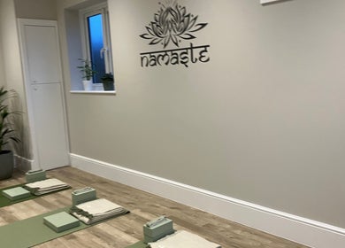 Yoga mats and props in serene room at Claire Elliott Coaching & Yoga, Buntingford, England, GB.
