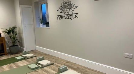 Yoga mats and props in serene room at Claire Elliott Coaching & Yoga, Buntingford, England, GB.