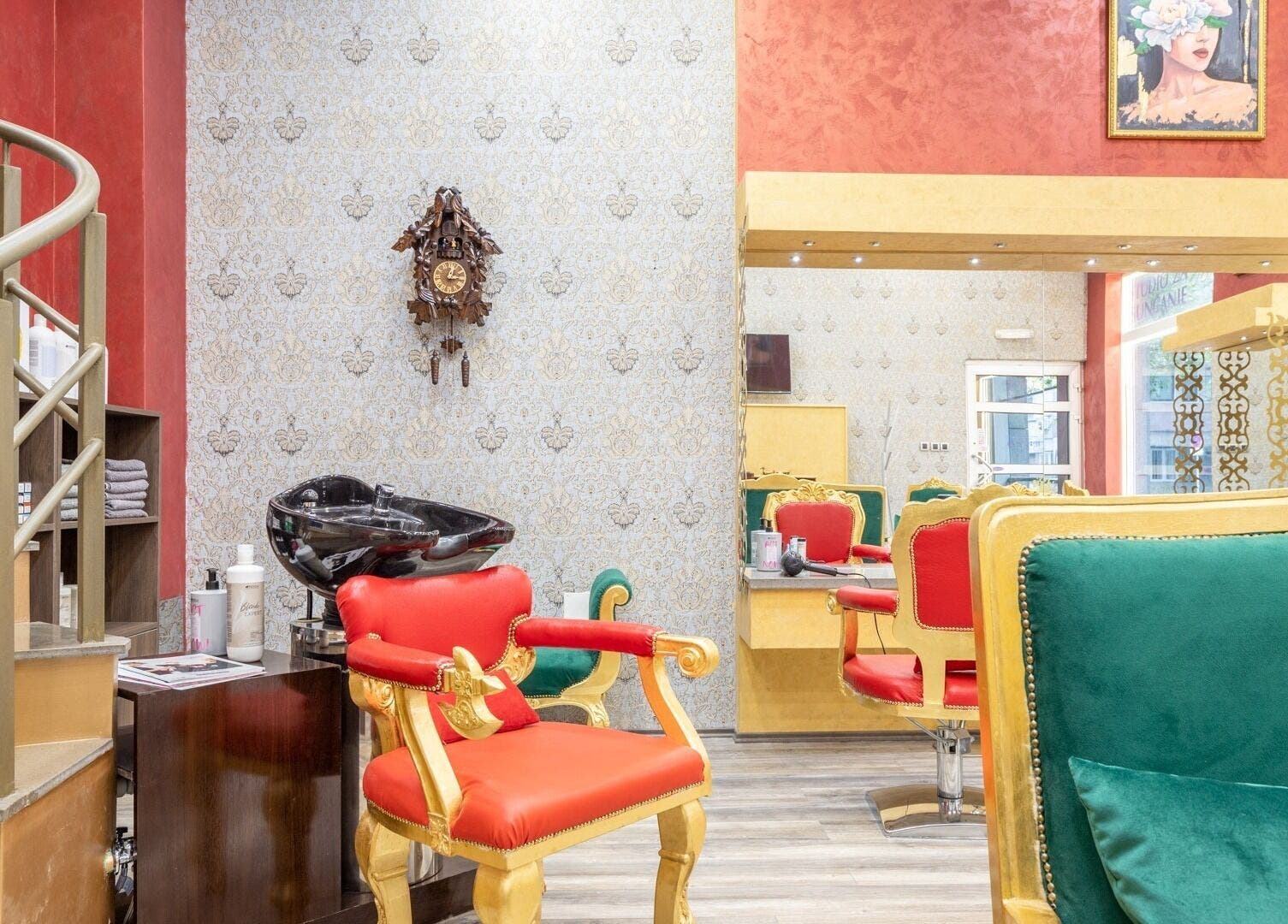 Interior of Raskoljnikov Beauty Studio in Beograd, RS, featuring stylish red and green salon chairs.