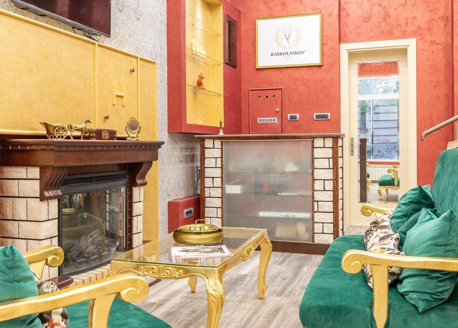 Lush, elegant interior of Raskoljnikov Beauty Studio, Београд, RS, featuring green velvet seating and gold accents.